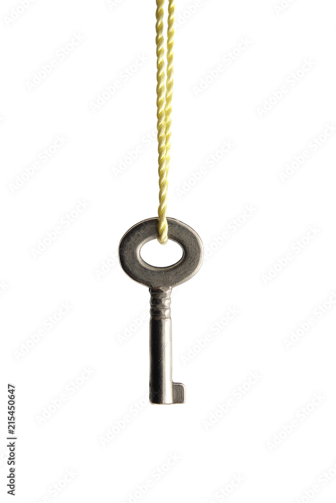 Small key hanging on a rope. Small key hanging on a rope.