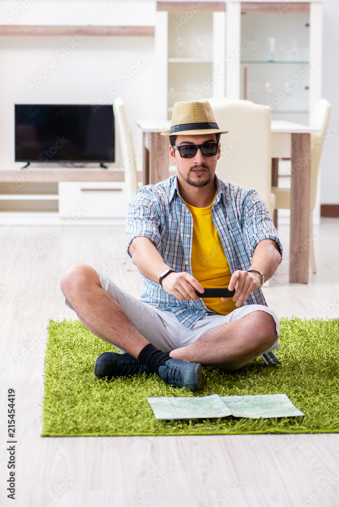 Fototapeta premium Man planning his travel with map