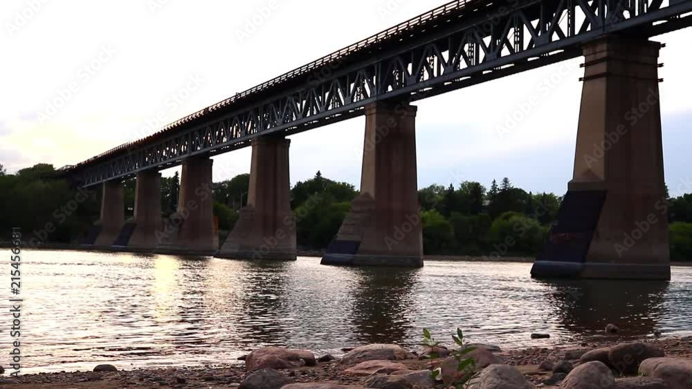 Along the river by the train bridge Along the river by the train bridge