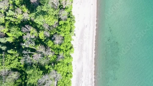 Wallpaper Mural Drone Shot Looking Down While Moving Along the Shore of a Lake on a Summer Day. Torontodigital.ca