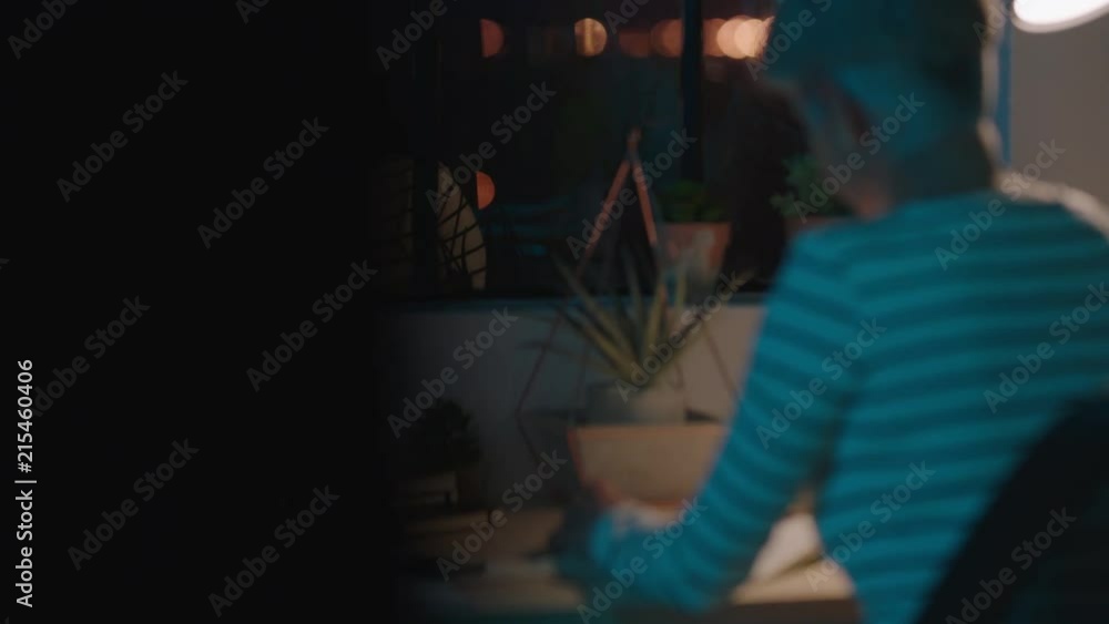 close up senior business woman working late sitting at desk writing mature female entrepreneur in home office workspace close up senior business woman working late sitting at desk writing mature female entrepreneur in home office workspace