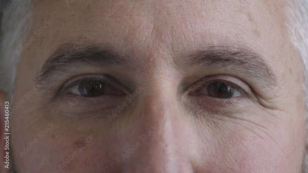 close up mature man opening eyes looking at camera healthy eyesight close up mature man opening eyes looking at camera healthy eyesight