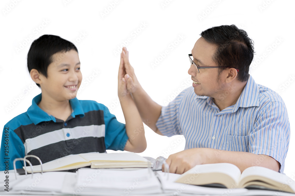 Father and child giving high five hands together Father and child giving high five hands together