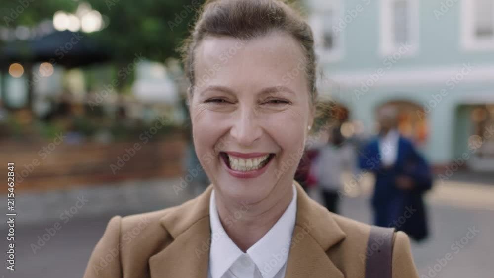 portrait of elegant mature business woman laughing cheerful in urban background wearing stylish suit jacket portrait of elegant mature business woman laughing cheerful in urban background wearing stylish suit jacket