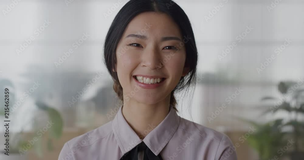 portrait young asian business woman intern laughing cheerful enjoying professional career beautiful ethnic female in office slow motion