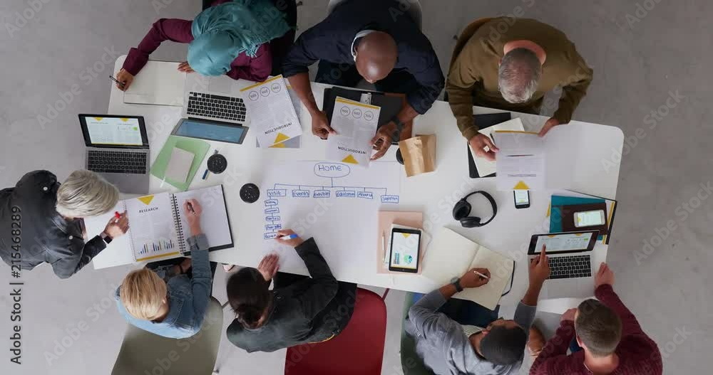 top view young diverse team of web developers brainstorming ideas for startup business website planning design layout in modern office workspace time lapse rotate