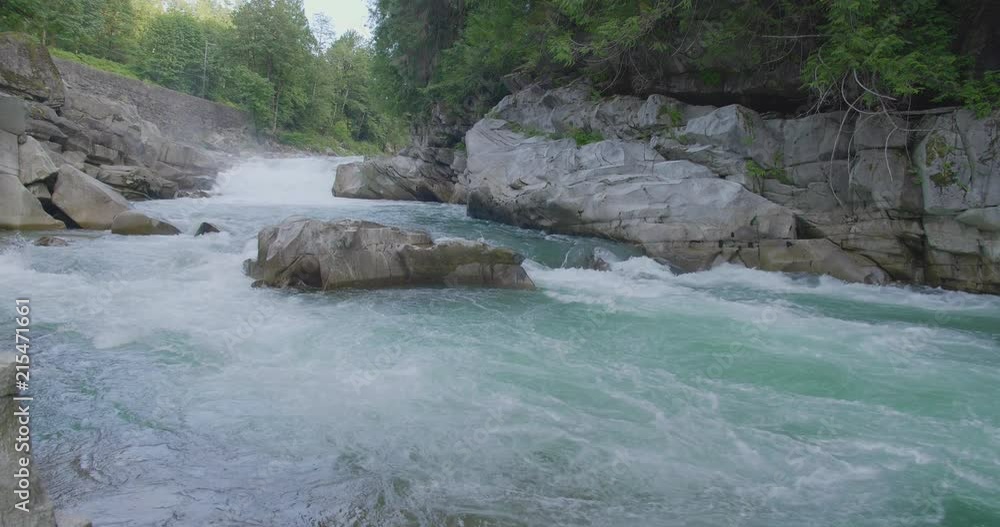 white water rapids streaming down the river in the great Puget Sound Northwest of Washington State. white water rapids streaming down the river in the great Puget Sound Northwest of Washington State.