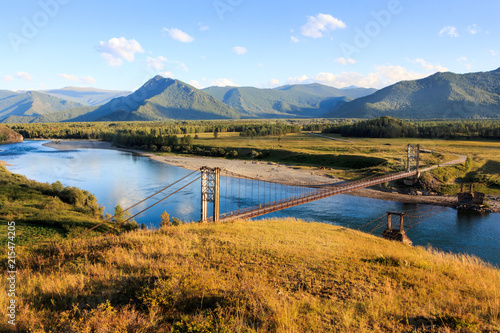 Bridge over the Katun river in the Cartoon, far mountain Filarete, Mountain Altai, Russia