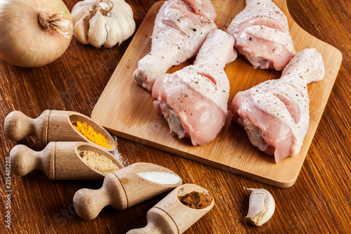 Raw chicken legs with spices