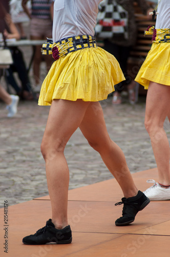closeup of women legs of salsa dancing in the street