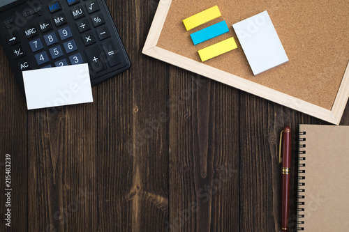 ffice supplies or office work essential tools or items on wooden desk in workplace, top view with copy space for add text. photo