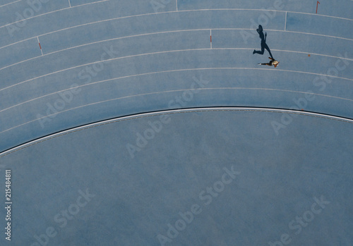 Aerial view of an athlete running on track