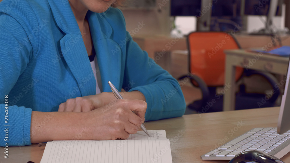 female hands writes in scratchpad female hands writes in scratchpad