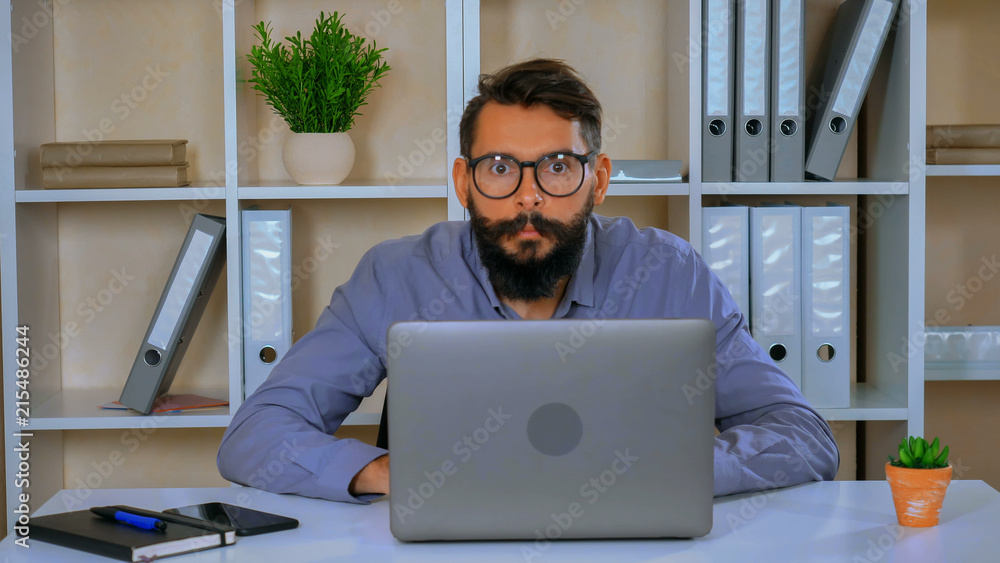 employee amusingly using computer employee amusingly using computer