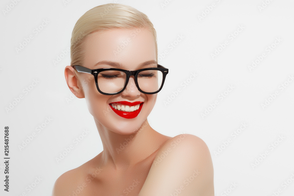Beauty sexy fashion model woman portrait wearing glasses, isolated on white background. Beautiful young blonde girl with trendy accessories posing in studio Beauty sexy fashion model woman portrait wearing glasses, isolated on white background. Beautiful young blonde girl with trendy accessories posing in studio