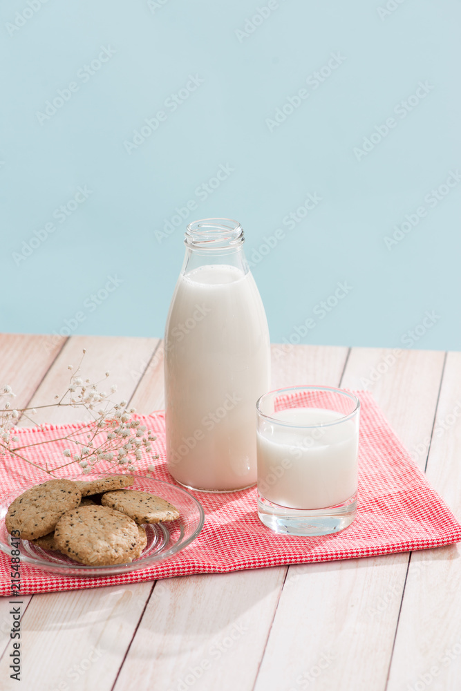 Pastry organic breakfast. Chip cookies and a glass of milk on a white wooden table. Pastry organic breakfast. Chip cookies and a glass of milk on a white wooden table.