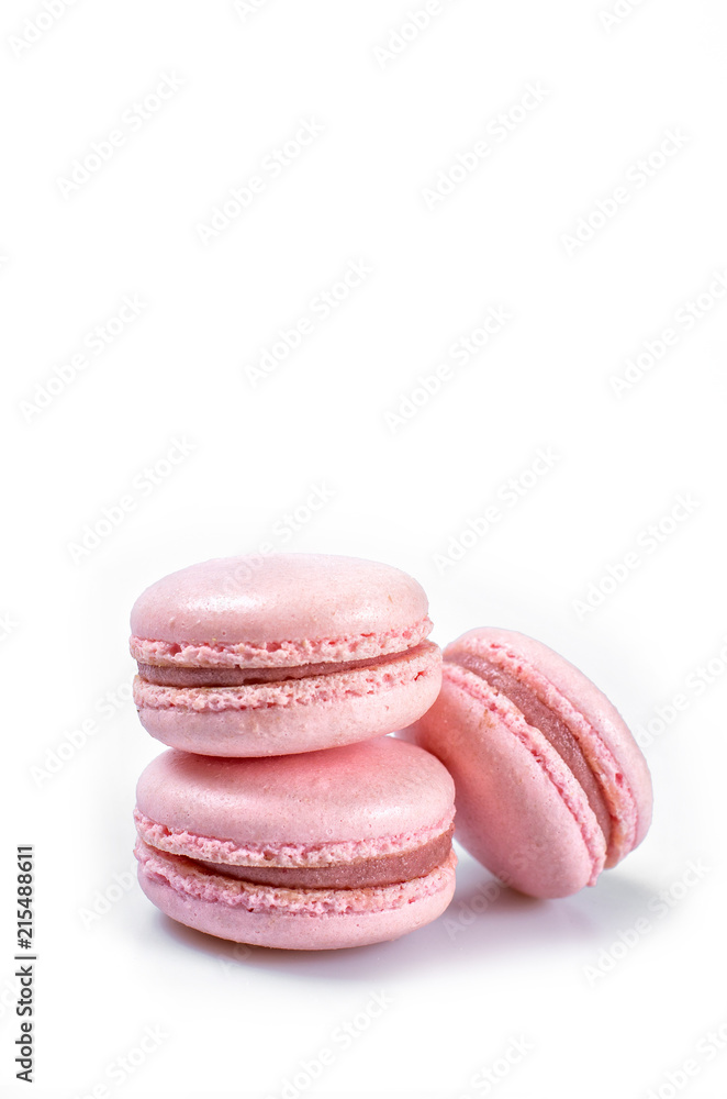 Fototapeta premium Pink macaroons or macaron isolated on a white background whith place for insert text. Copy space
