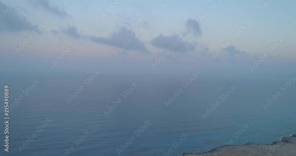 Drone flying over a mountain towards the sea in the morning while the sun is coming up at 4K . Shot on a Phantom 4 Pro. Drone flying over a mountain towards the sea in the morning while the sun is coming up at 4K . Shot on a Phantom 4 Pro.