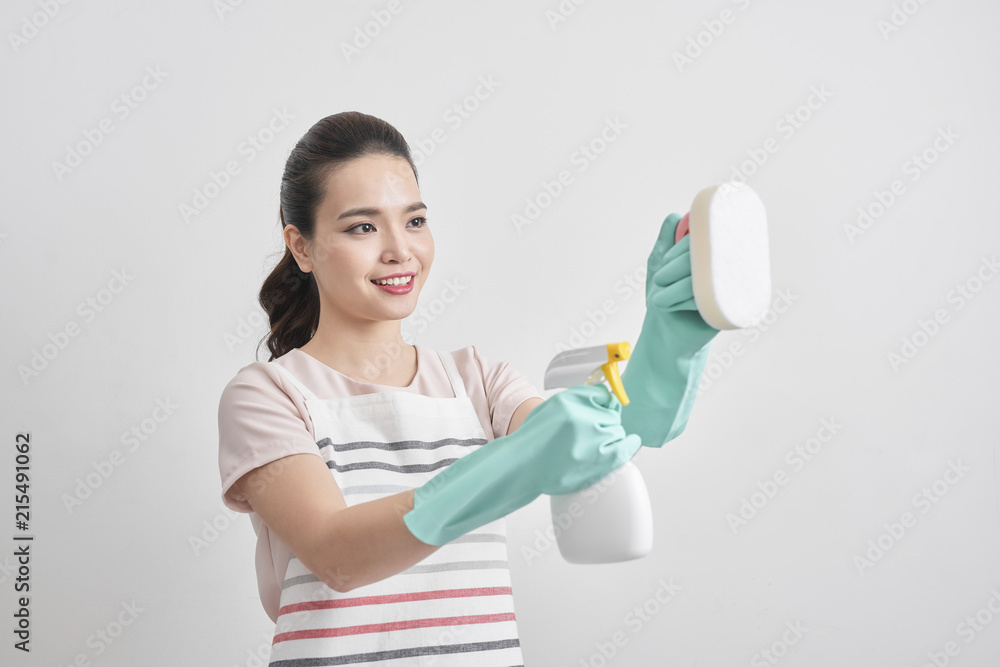 Young woman holding group of cleaning supplies. Household equipment, spring-cleaning, tidying up, cleaning service concept Young woman holding group of cleaning supplies. Household equipment, spring-cleaning, tidying up, cleaning service concept