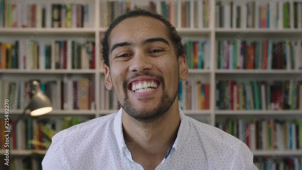close up portrait of attractive young hispanic man student laughing cheerful in library study background enjoying learning education close up portrait of attractive young hispanic man student laughing cheerful in library study background enjoying learning education