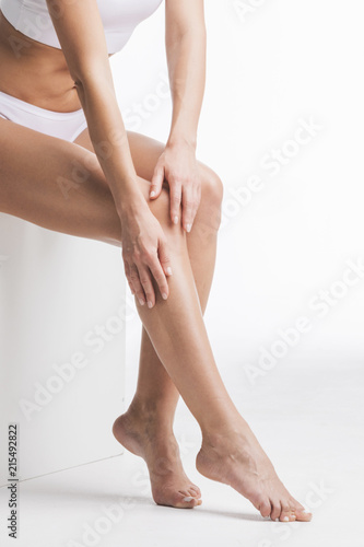 Woman touching legs