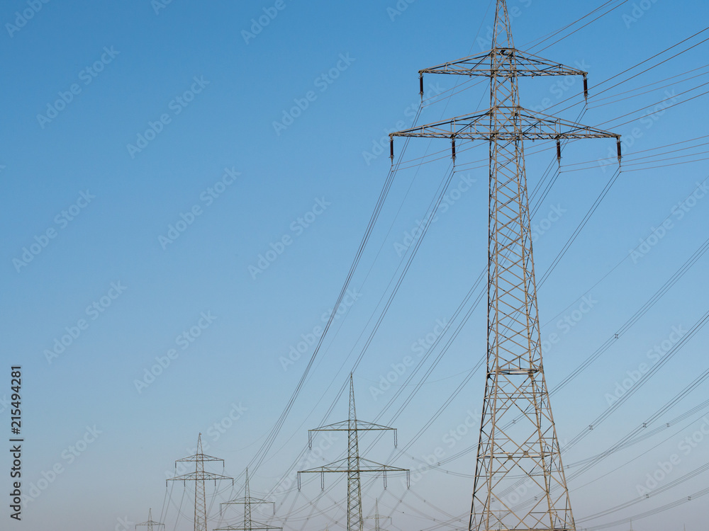 Electricity Pylons and Lines against blue sky background. Electricity Pylons and Lines against blue sky background.