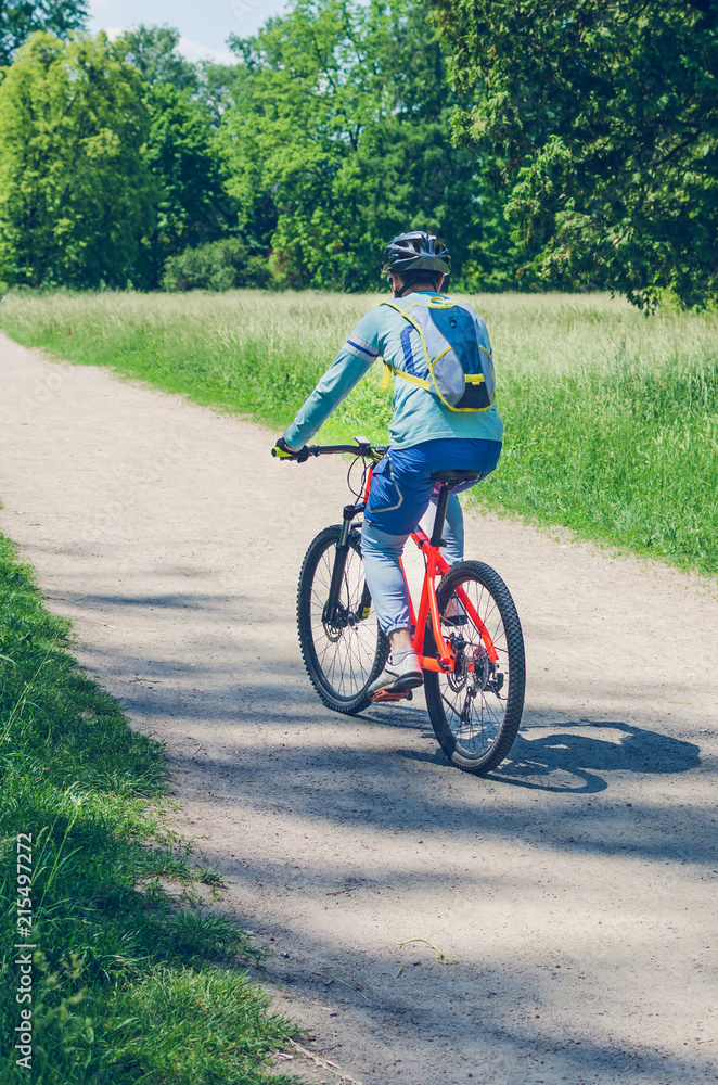 Obraz premium The cyclist in motion riding bicycle road