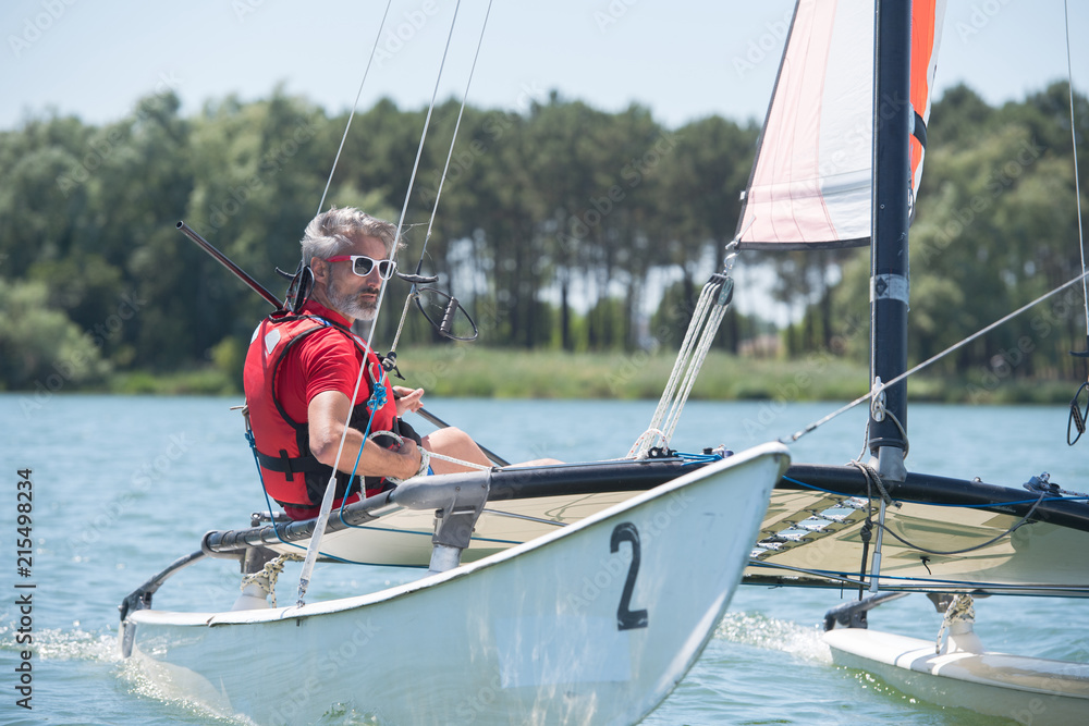 Fototapeta premium man pleasure boating on a lake