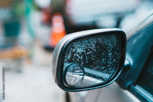 Road Car Rear View Mirror or Side Mirror Car after rain, Motion Blur Background (Vintage Style)