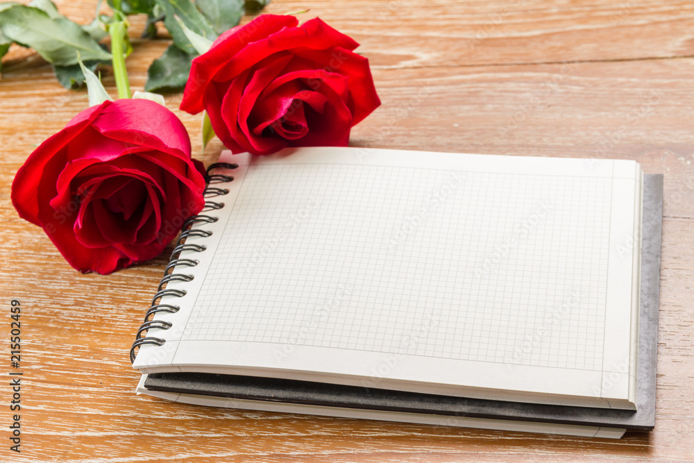 red rose and blank notebook red rose and blank notebook