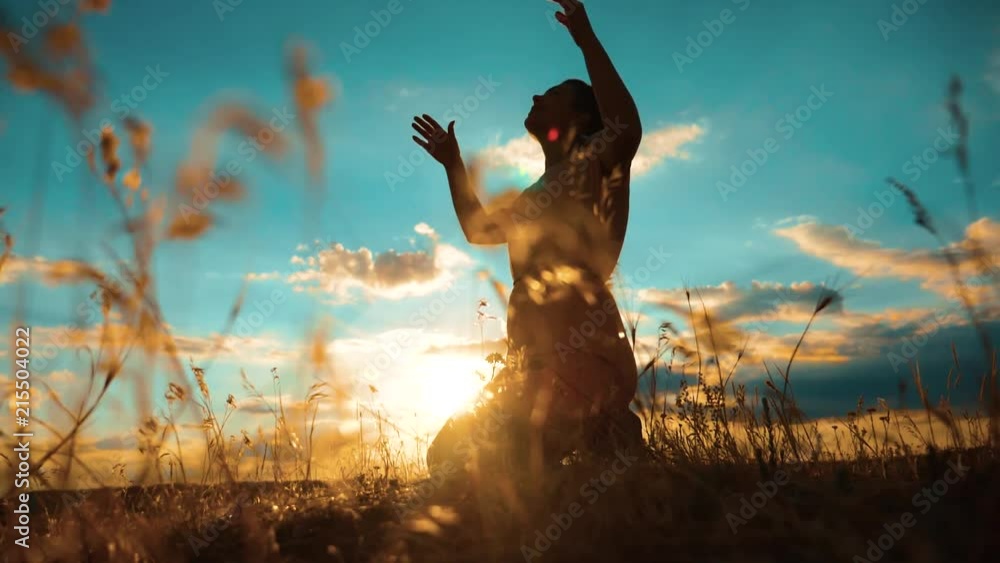 Praying Motion woman praying on her knees. Girl folded her hands in prayer silhouette ...