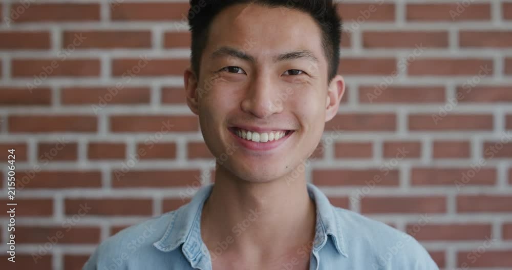 portrait independent young asian man laughing enjoying success looking happy confident male student slow motion portrait independent young asian man laughing enjoying success looking happy confident male student slow motion
