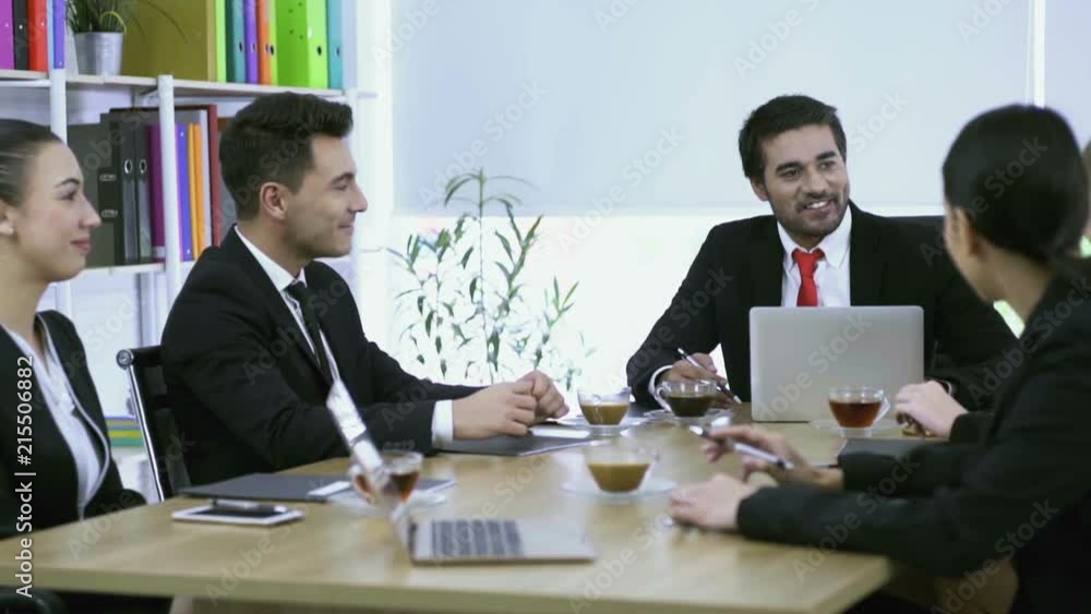 A group of businessmen & women having a business discussion, strategy and presentation in the company’s boardroom A group of businessmen & women having a business discussion, strategy and presentation in the company’s boardroom