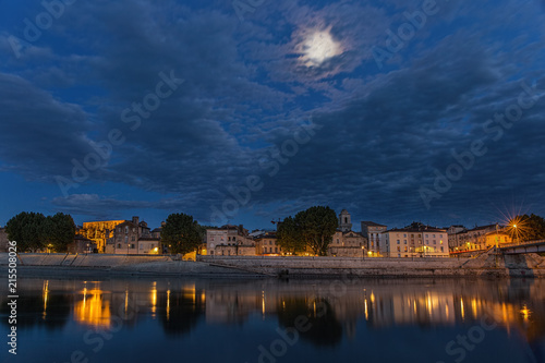 .Night panoramic view of the French city of Arles on the River Rhône. Provence. France.