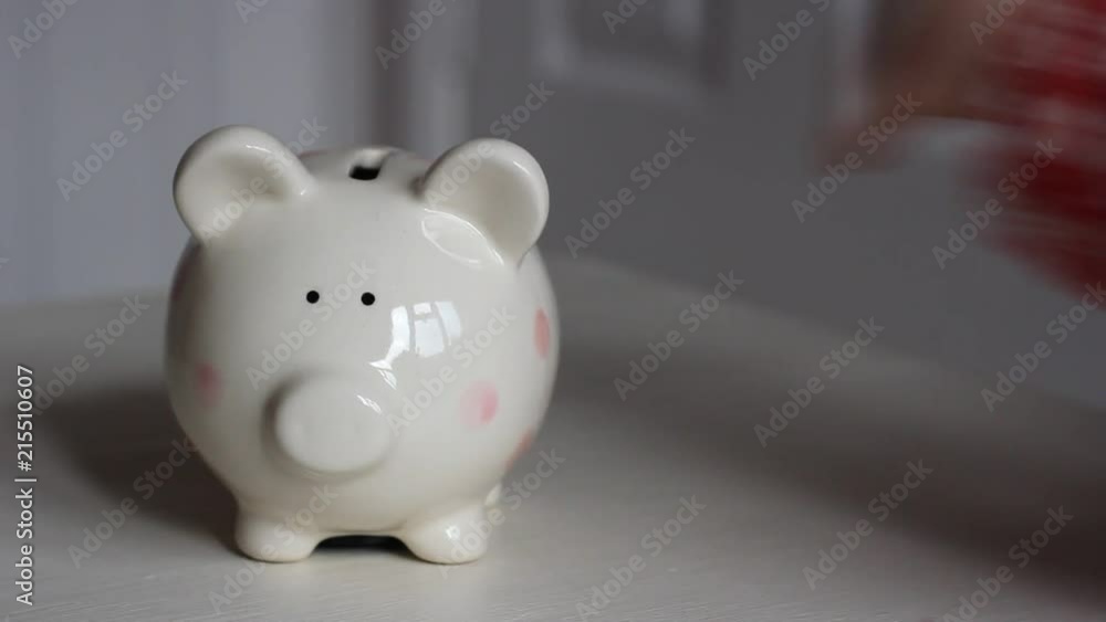 Small girl saving her money in money box. Small girl saving her money in money box.