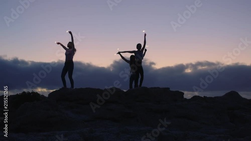 Wallpaper Mural group of happy friends dancing waving sparklers celebrating joyful happy Torontodigital.ca