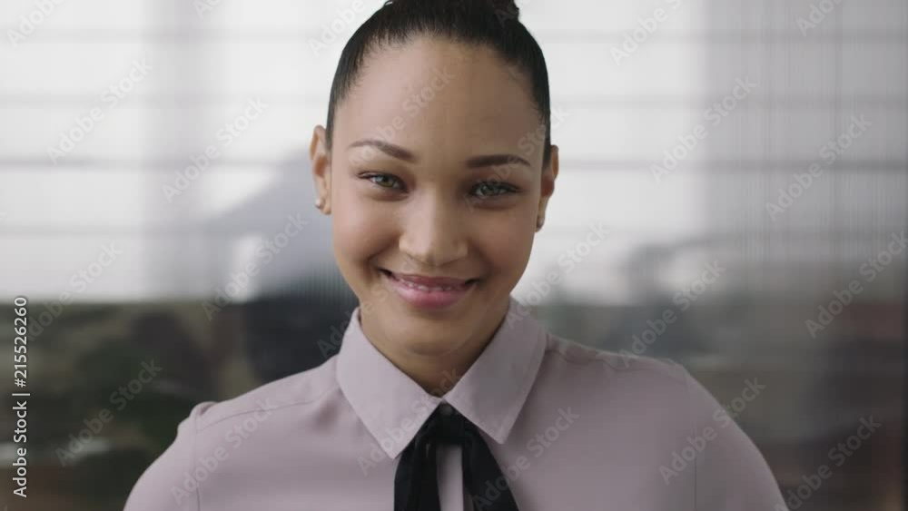 portrait of beautiful young mixed race business woman intern smiling happy looking at camera enjoying corporate job opportunity portrait of beautiful young mixed race business woman intern smiling happy looking at camera enjoying corporate job opportunity