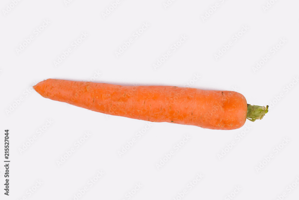 Fresh carrot on white background. Close up. One single orange carrot isolated on white. Fresh carrot on white background. Close up. One single orange carrot isolated on white.