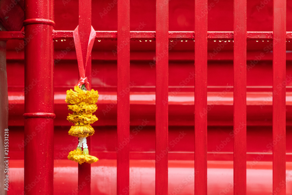 Religious offerings of marigold strings presented at temple Religious offerings of marigold strings presented at temple