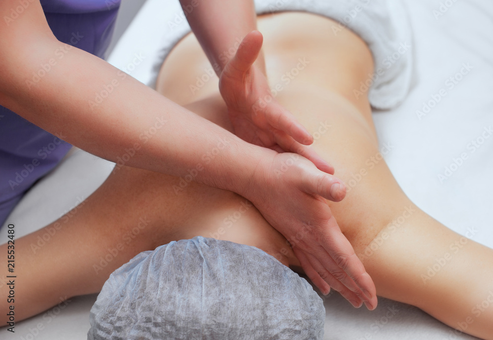 The masseur makes massage on the neck and back of the patient in the beauty salon. Medical assistance for the body. The masseur makes massage on the neck and back of the patient in the beauty salon. Medical assistance for the body.