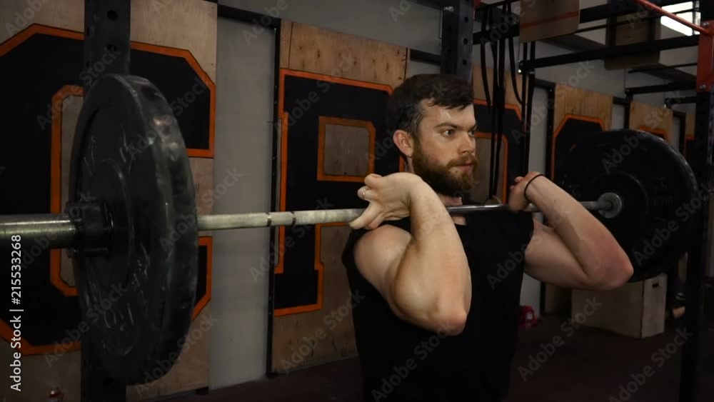 Closeup of weightlifter doing squats.Full hd video Closeup of weightlifter doing squats.Full hd video