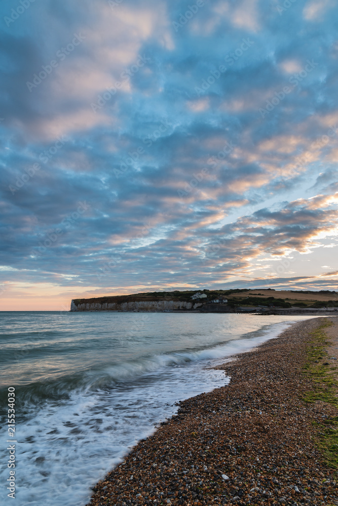 Stunning colorful dramatic Summer sunset over Seven Sisters landscape in Englad