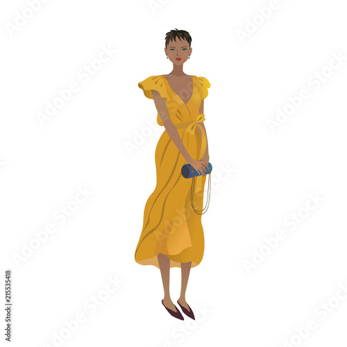 2018 fashion model in a trendy summer outfit. Fashionable girl in a yellow wraparound dress holding a small handbag.