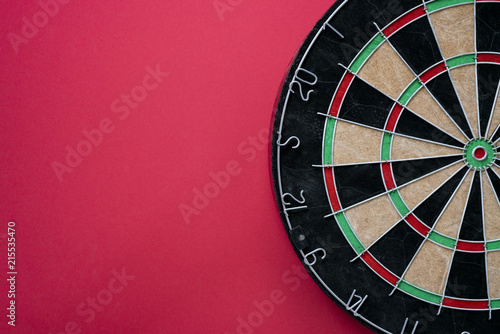 Target dart board on the red background, center point, head to target marketing and business concept