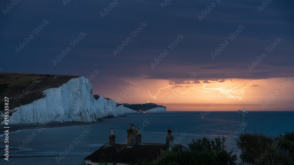 Stunning moody electrical lightning storm over white cliffs landscape, on English South Coast