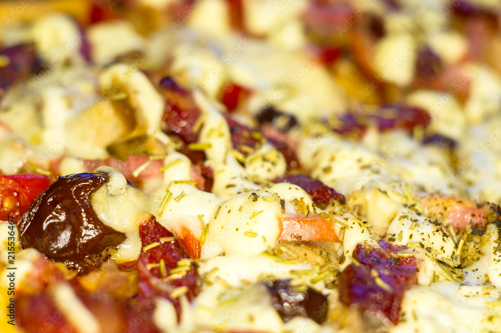 homemade pizza with peppers, plums, ham, sausage, cheese and spices, closeup homemade pizza with peppers, plums, ham, sausage, cheese and spices, closeup