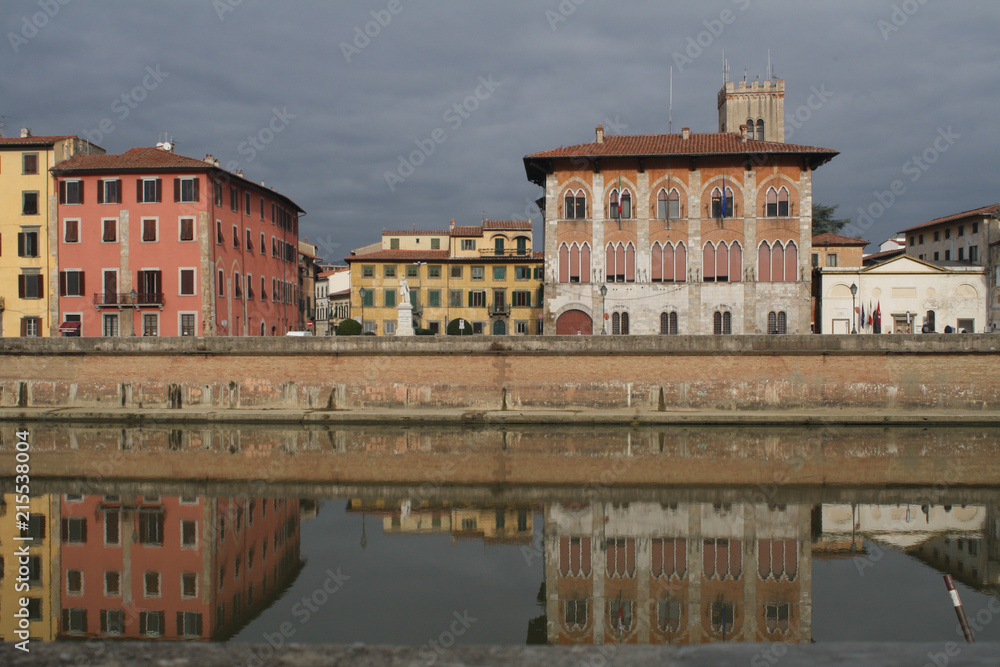 Reflections on Arno river on a cloudy day