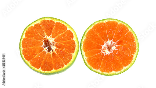 green tangerine on white background.