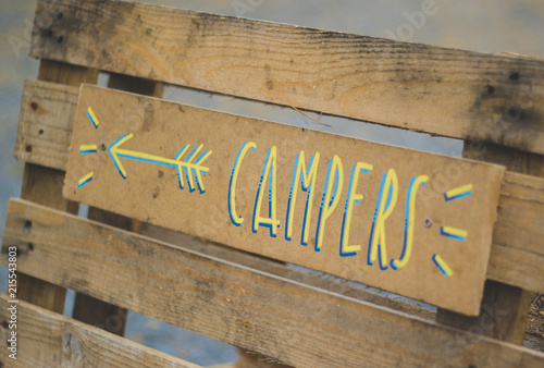 Hand written sign for campers at glamping site
