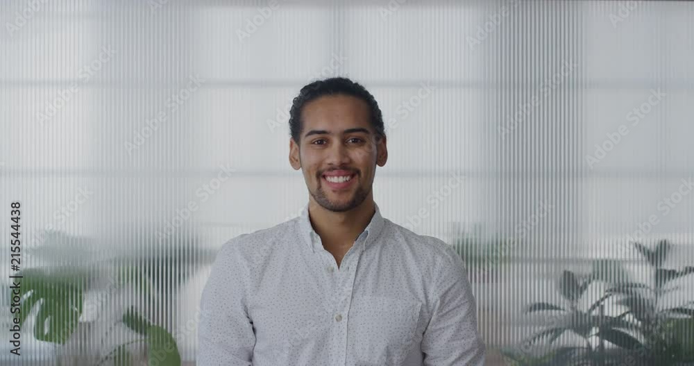portrait handsome young hispanic entrepreneur man smiling enjoying professional career success slow motion portrait handsome young hispanic entrepreneur man smiling enjoying professional career success slow motion